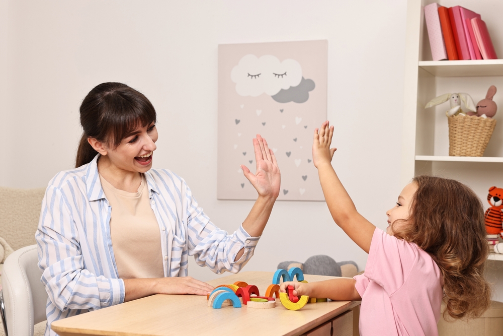 Autism Clinic Nurse working with child