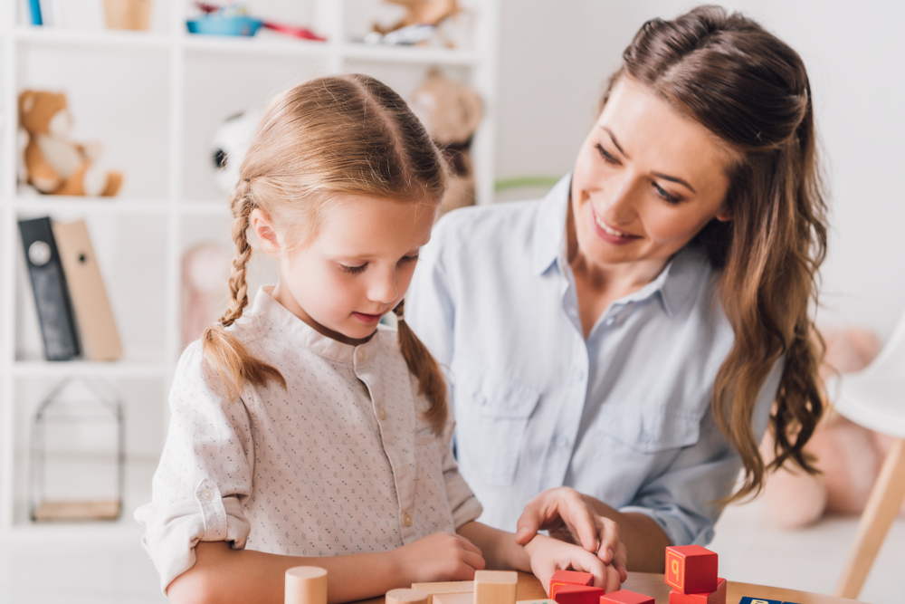 Autism Clinic Nurse working with child