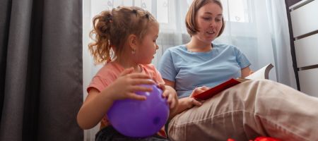 autistic child learning with parent