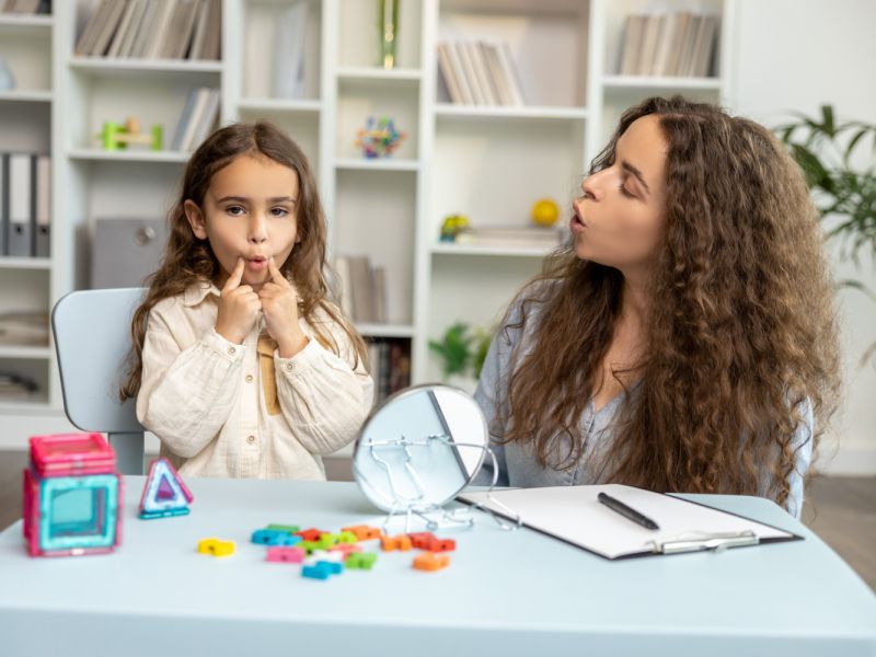 child learning with therapist