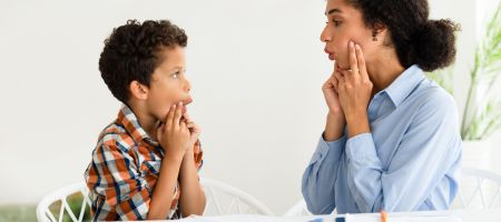 child learning with therapist