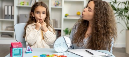 child learning with therapist