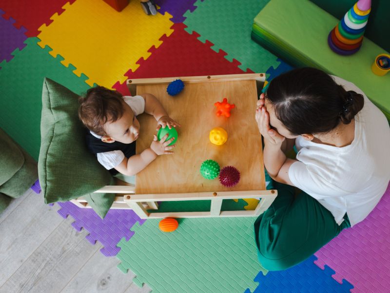 child playing with balls
