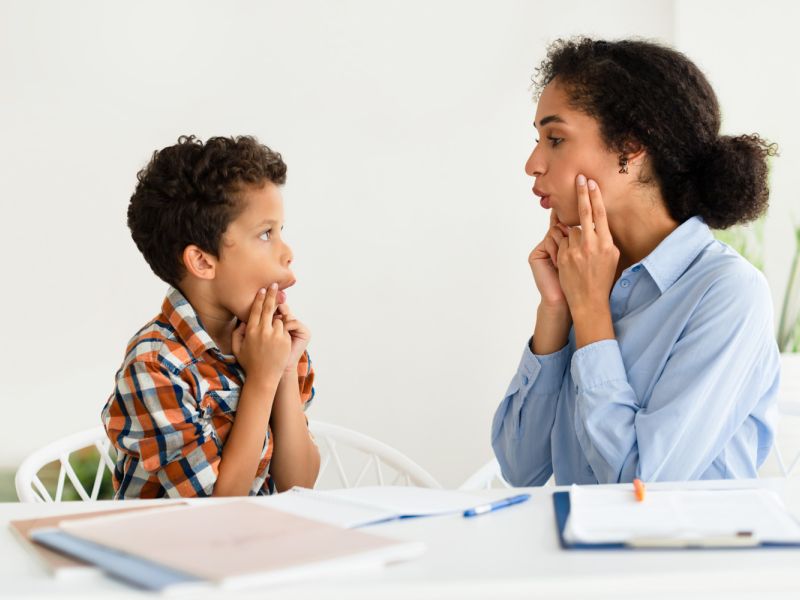 child learning with therapist
