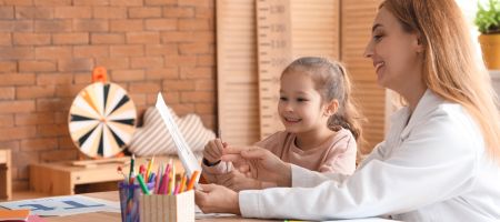 child learning with therapist