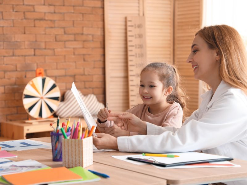 child learning with therapist