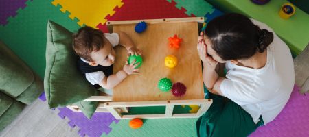 child playing with balls
